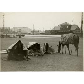 Men Sheltering Under Tarpaulins, 1936